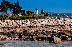 Bird Island Lighthouse Behind Breakwater in Massachusetts